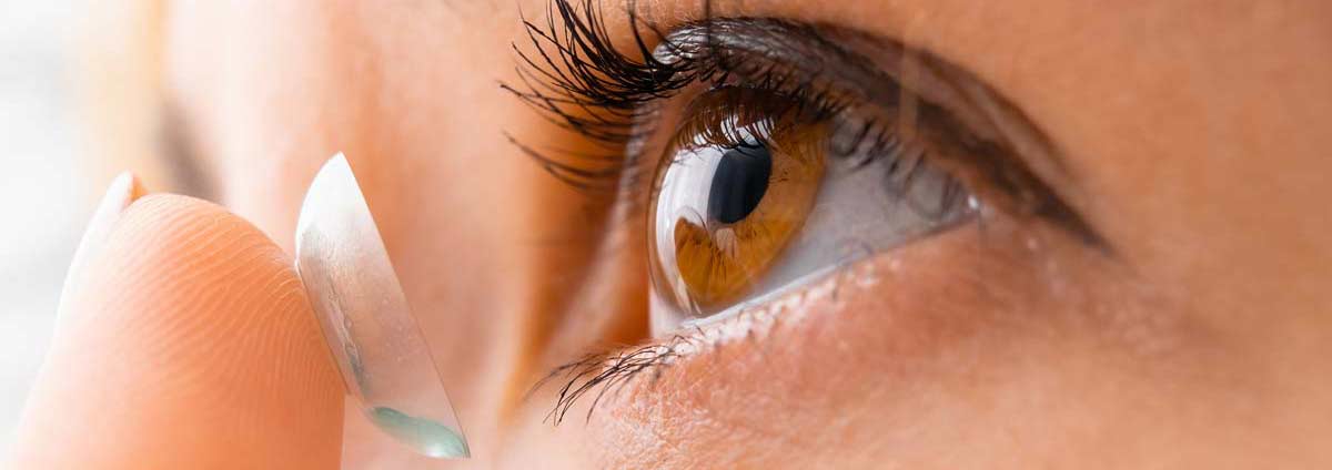 putting in a contact lens