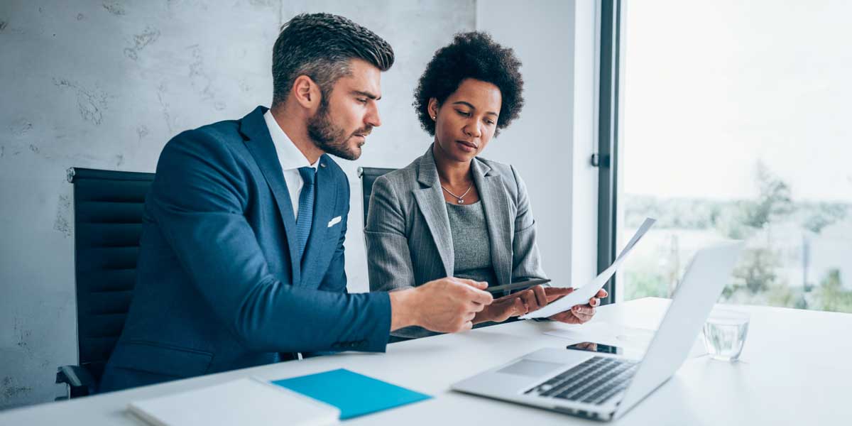 Two people working together at a desk