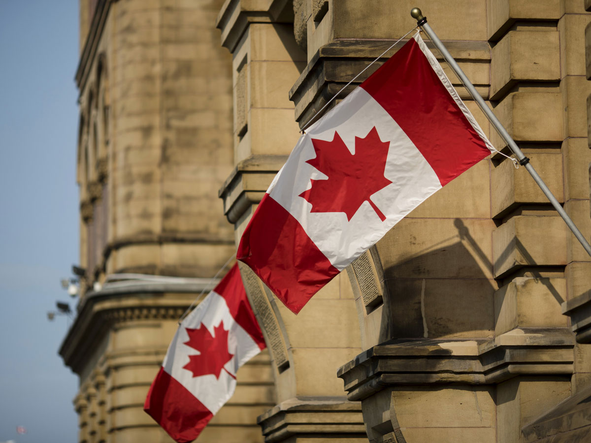 Canadian flags outside parliament building