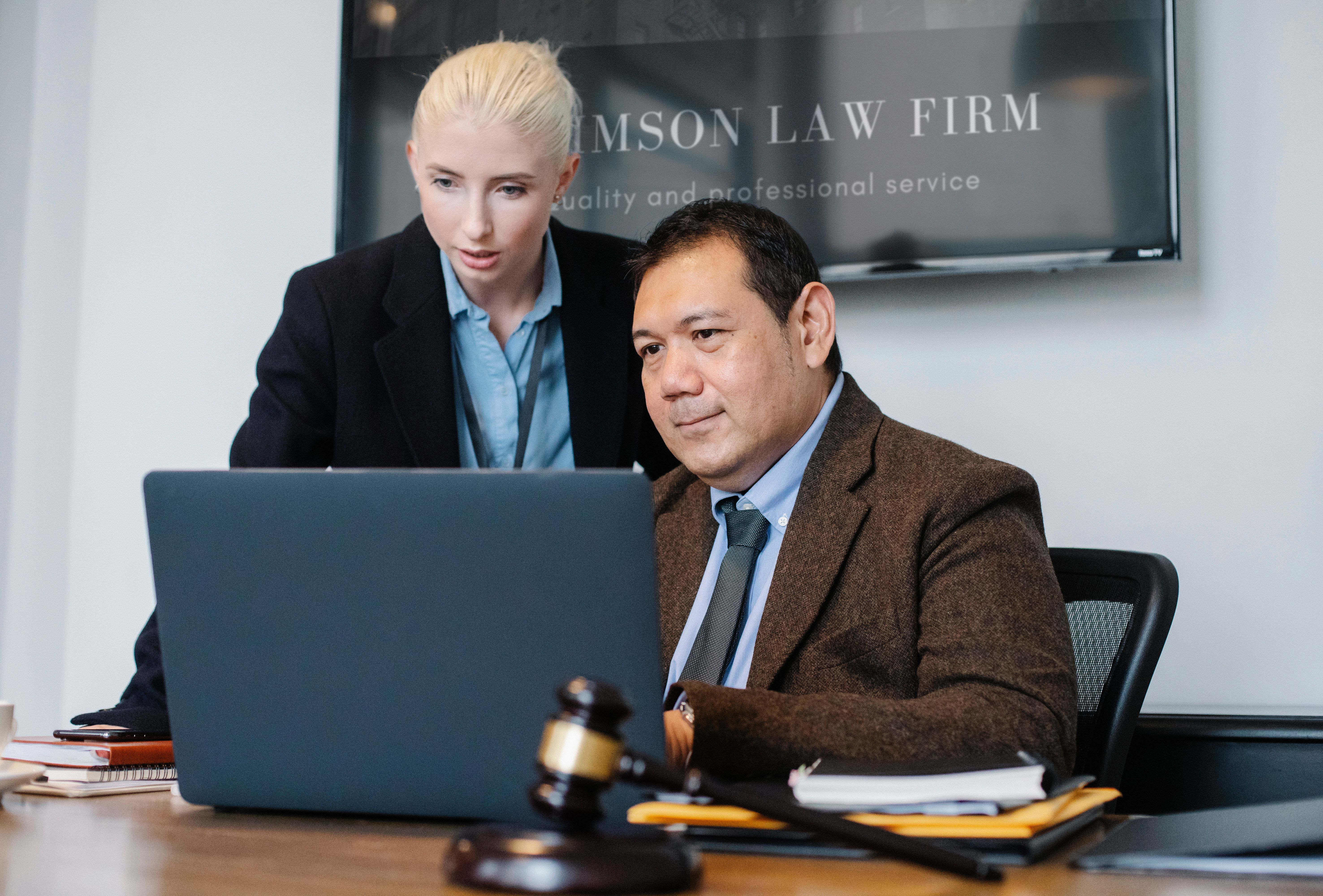Two people working in office.
